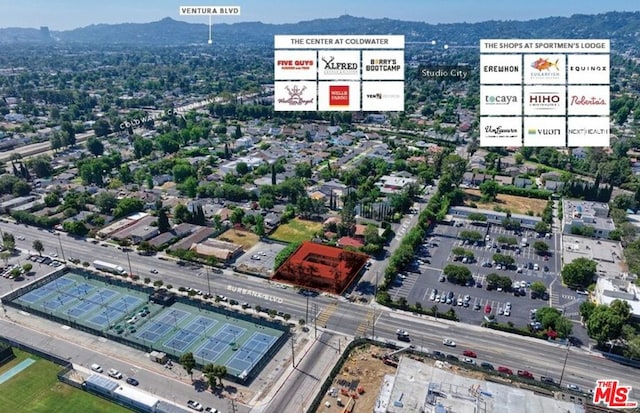 birds eye view of property with a mountain view