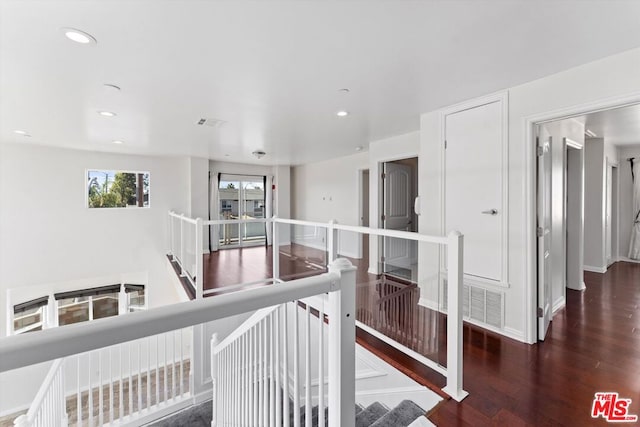 hall with dark wood-type flooring