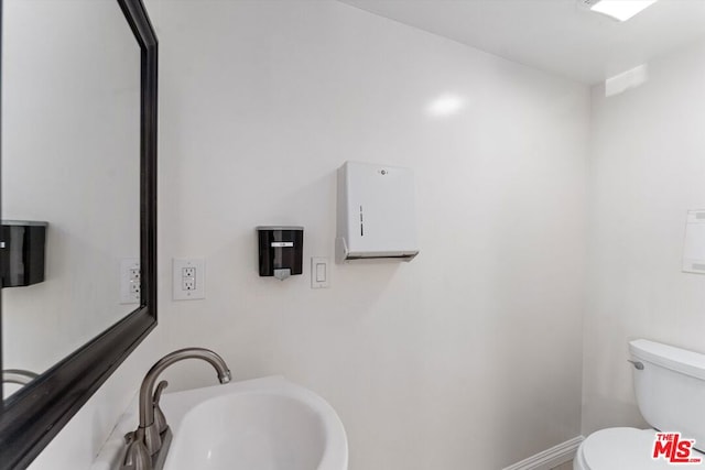 bathroom with toilet and sink