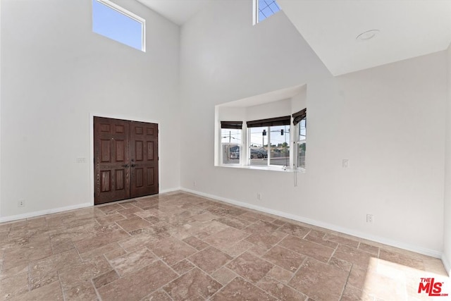 spare room with a high ceiling