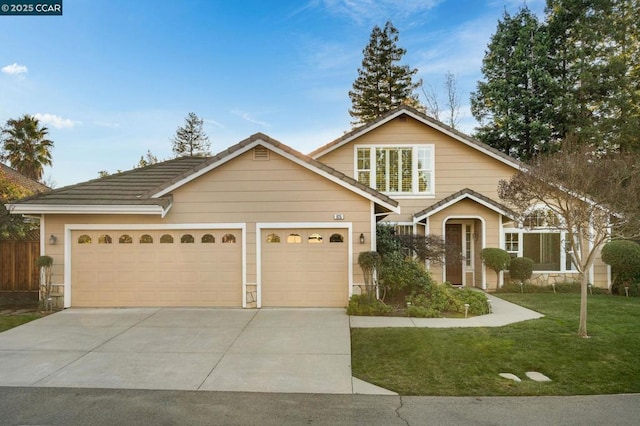 view of front facade with a front lawn and a garage