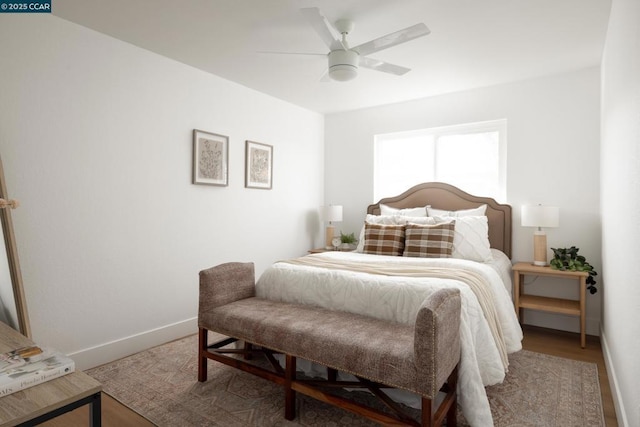 bedroom with wood-type flooring and ceiling fan