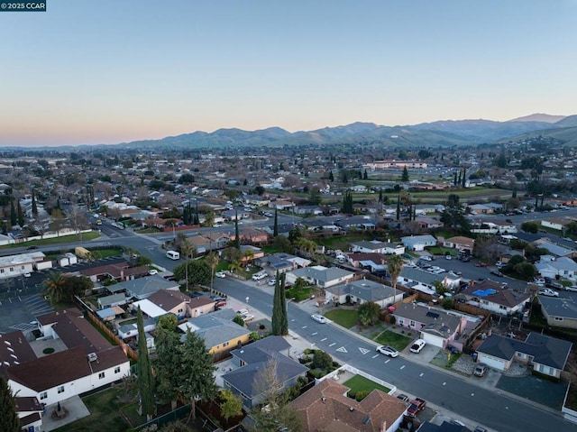 aerial view at dusk with a mountain view