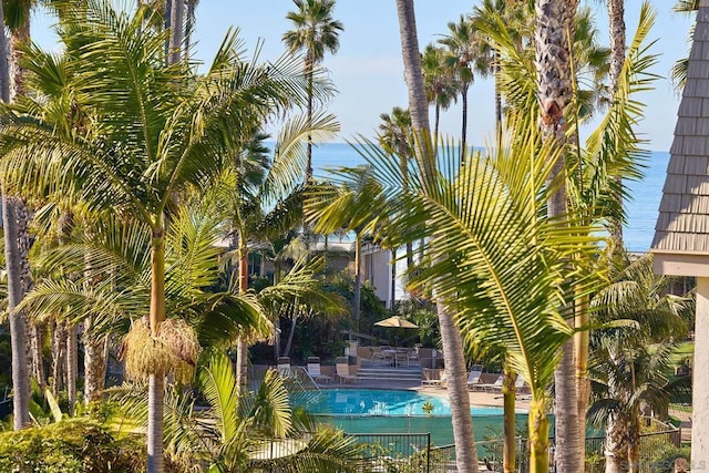 view of pool with a water view