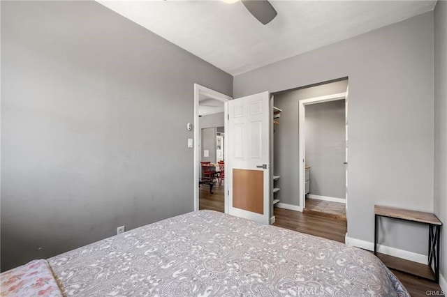 bedroom featuring ceiling fan and dark wood-type flooring