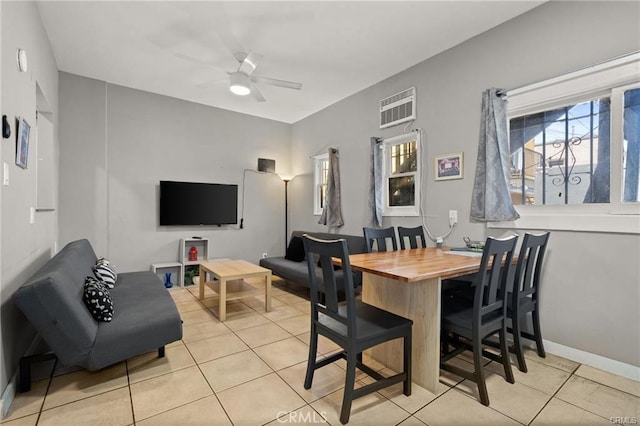 dining room with ceiling fan and light tile patterned flooring