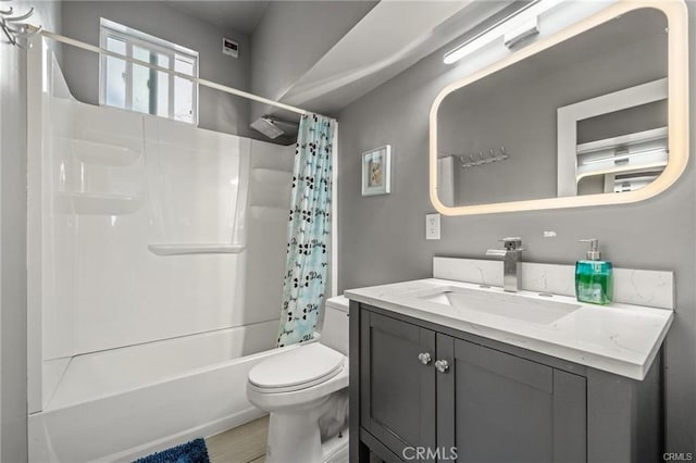 full bathroom with toilet, vanity, and shower / bath combination with curtain