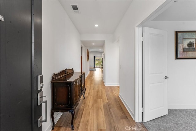 hallway with light wood-type flooring