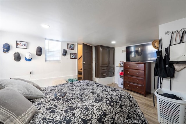 bedroom with light wood-type flooring