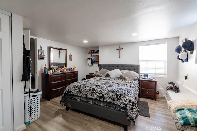 bedroom with light wood-type flooring