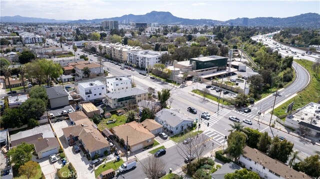 birds eye view of property featuring a mountain view