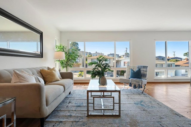 living room featuring parquet floors