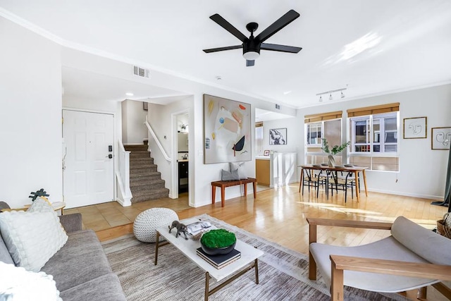 living room with ceiling fan, track lighting, and wood-type flooring