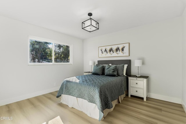 bedroom with light wood-type flooring