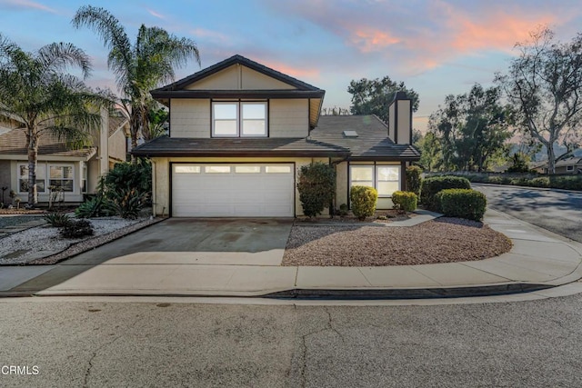 front of property with a garage