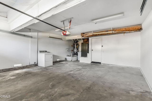 garage featuring washer / dryer and a garage door opener