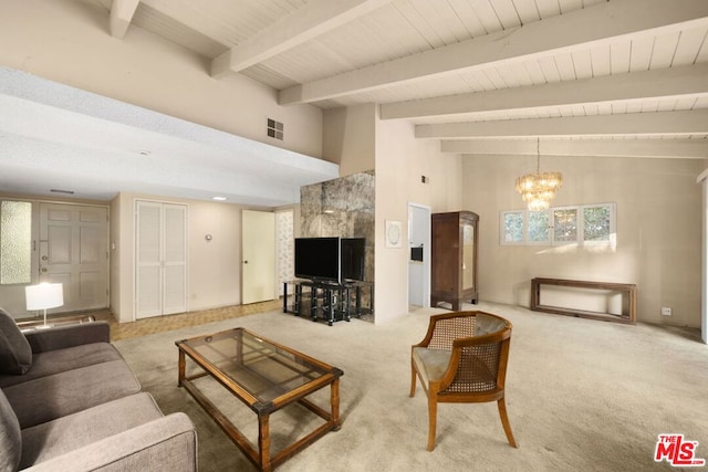 living room featuring carpet floors, a high ceiling, beam ceiling, and a notable chandelier