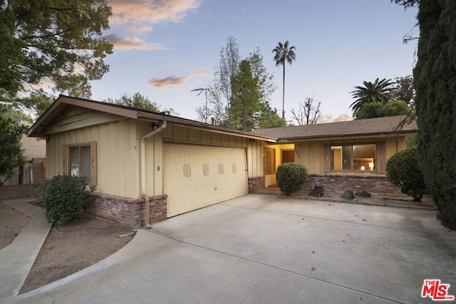 ranch-style home featuring a garage