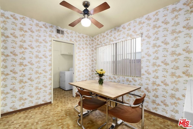 dining area with ceiling fan, light parquet flooring, and washer / clothes dryer