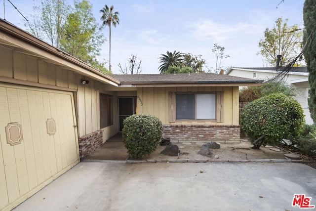 doorway to property with a patio