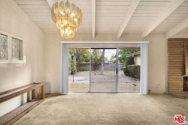 interior space featuring beam ceiling, carpet, and a notable chandelier