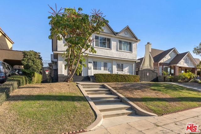 view of front facade featuring a front yard