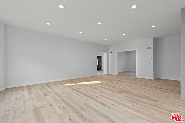 unfurnished room featuring light hardwood / wood-style floors