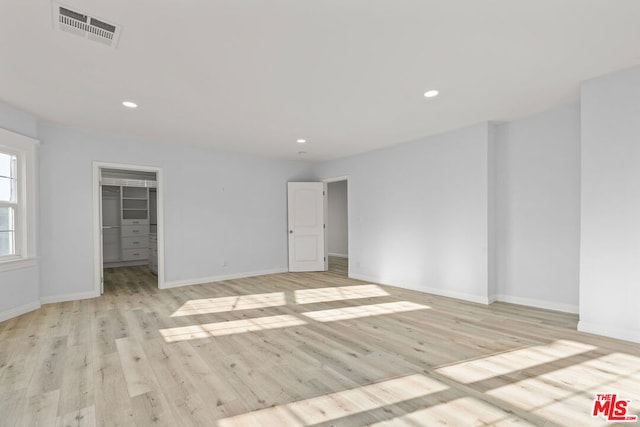 unfurnished room with light hardwood / wood-style flooring