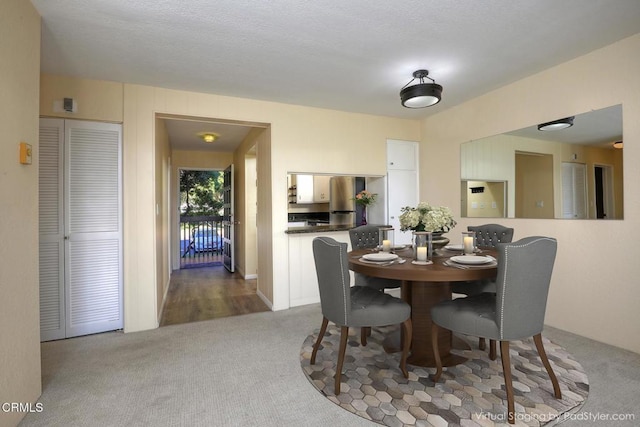 dining area with light colored carpet