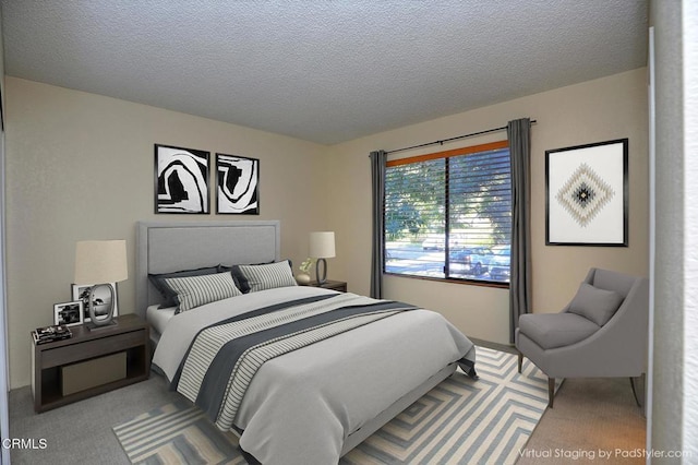 bedroom with a textured ceiling and carpet