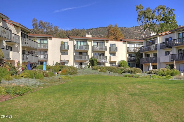 view of building exterior with a mountain view