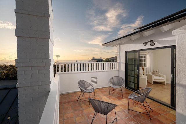 view of patio terrace at dusk