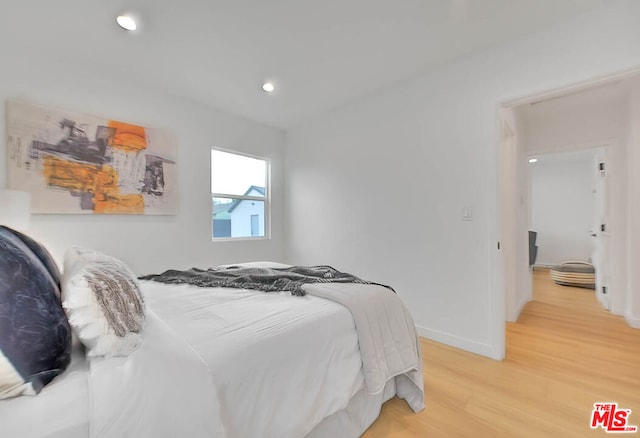 bedroom with light wood-type flooring