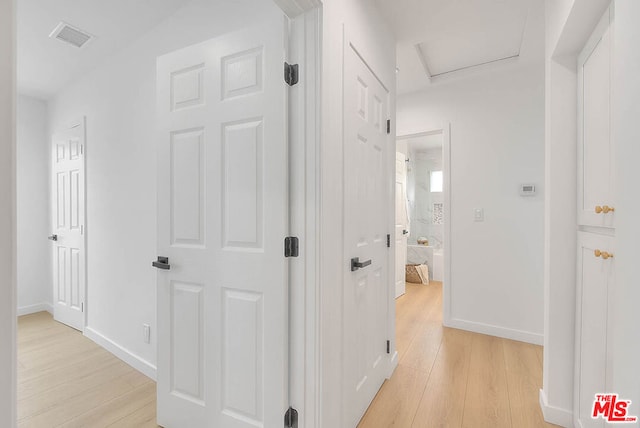 hall featuring light hardwood / wood-style flooring