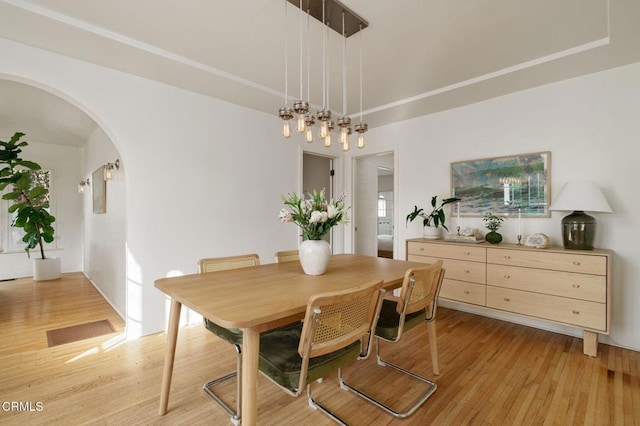 dining area with light hardwood / wood-style floors