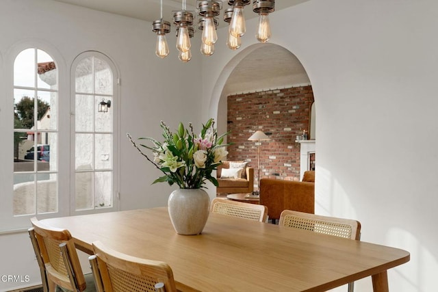 dining space featuring a fireplace