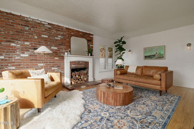 living room with a fireplace and light hardwood / wood-style flooring