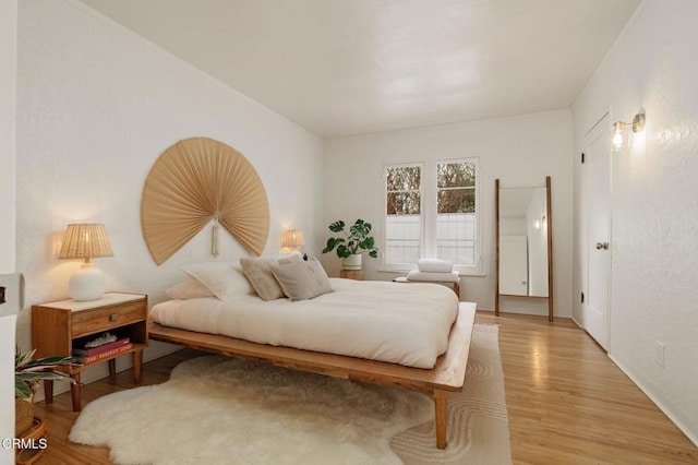 bedroom with light wood-type flooring