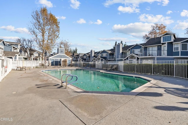 view of swimming pool featuring a patio