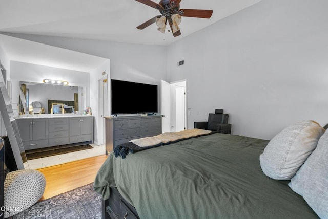 bedroom featuring vaulted ceiling, ceiling fan, and wood-type flooring