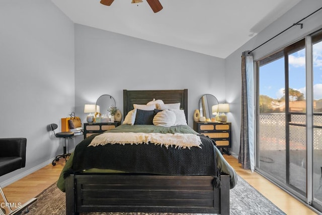 bedroom with vaulted ceiling, ceiling fan, access to exterior, and hardwood / wood-style flooring