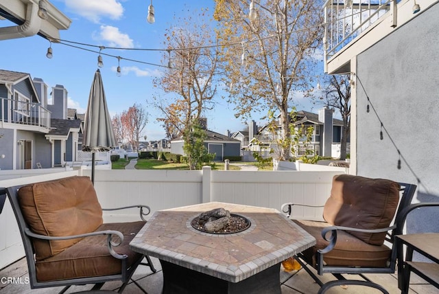 view of patio with an outdoor fire pit