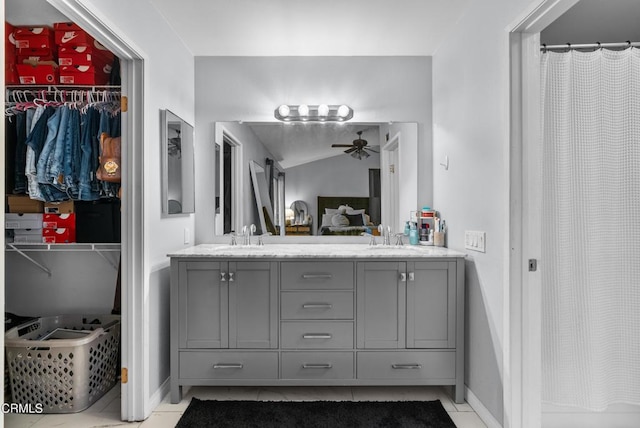 bathroom featuring ceiling fan, vanity, and tile patterned flooring