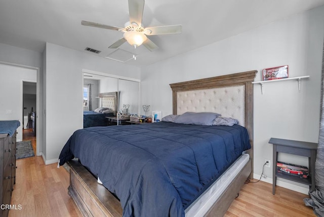 bedroom with ceiling fan, a closet, and light hardwood / wood-style floors