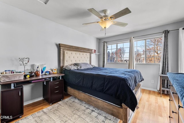 bedroom featuring light wood-type flooring and ceiling fan