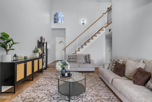 living room with a towering ceiling