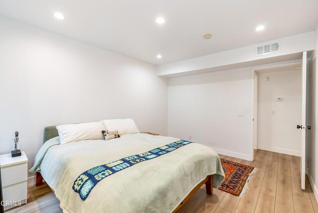 bedroom with light hardwood / wood-style flooring