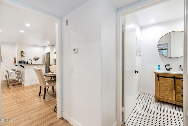 bathroom with vanity and wood-type flooring