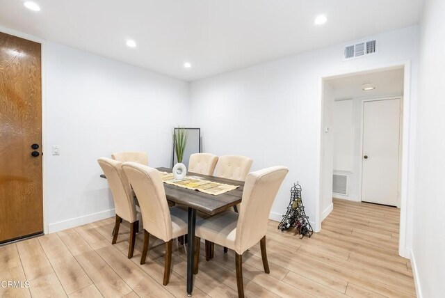 dining space with light wood-type flooring