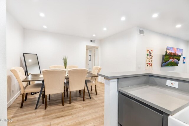 dining space featuring light hardwood / wood-style flooring